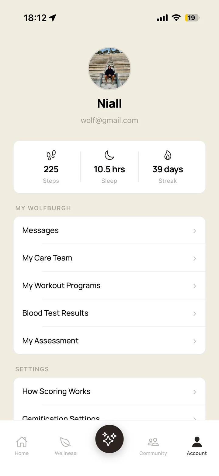 Wolfburgh app account screen with messages, care team, workout programs and blood test results